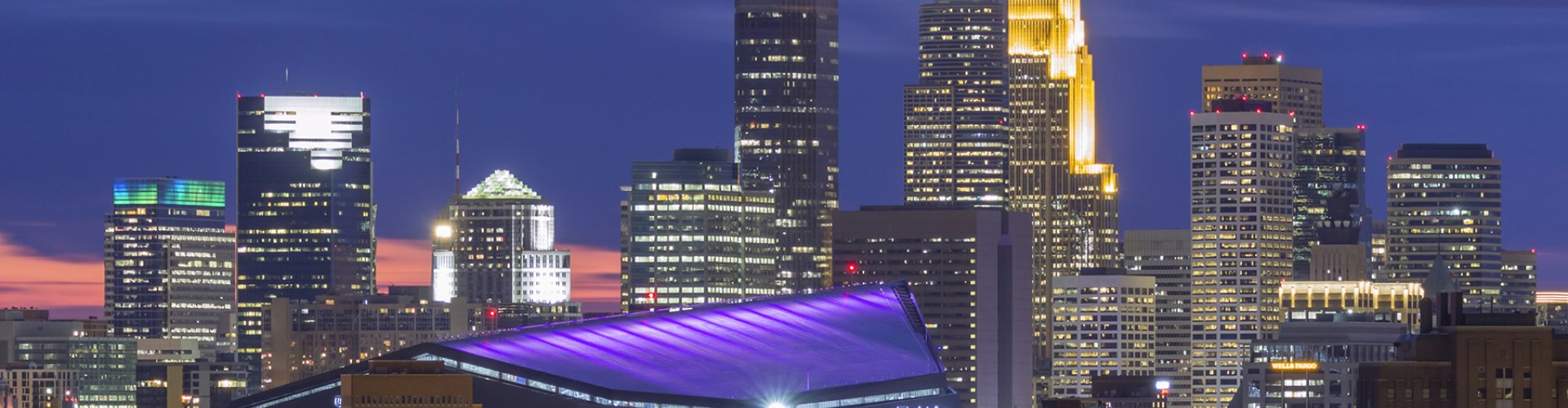 Evening riverside shot of Minneapolis skyline